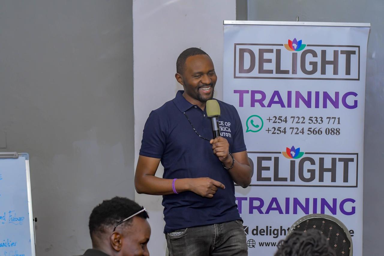 Mr. Saitoti Meitamei giving opening remarks at the Tuza Experience Nairobi